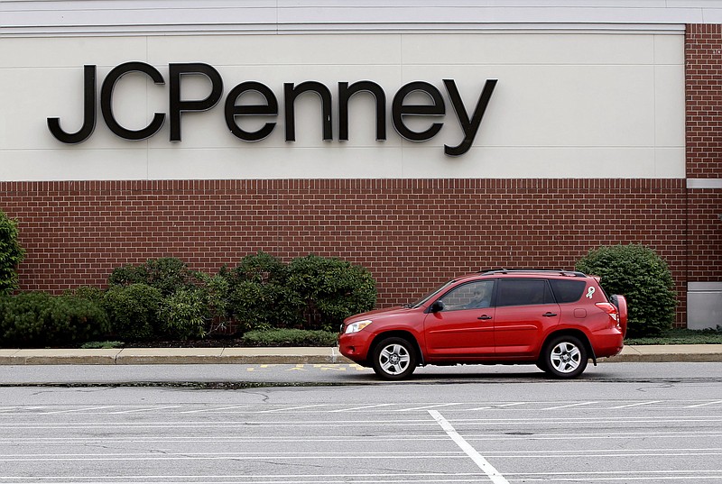 
              In this Friday, July 10, 2015 photo, a car drives through an empty JC Penney department store parking lot at the Hanover Mall in Hanover, Mass. J.C. Penney Co. reports quarterly financial results on Friday, Aug. 14, 2015. (AP Photo/Stephan Savoia)
            