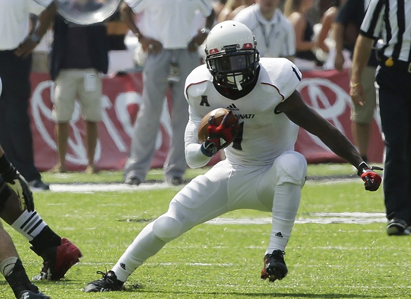 Tennessee running back Ralph David Abernathy IV, shown during 2013 while playing for the University of Cincinnati in a game against Purdue, is among the offensive options the Volunteers have as they prepare for a new season. Abernathy, who missed most of last season because of injury, is a graduate student at Tennessee and playing for the Vols as a fifth-year senior, eligibility-wise. He is the grandson of famed civil rights leader Ralph David Abernathy Sr. and the brother of Vols freshman defensive back Micah Abernathy.