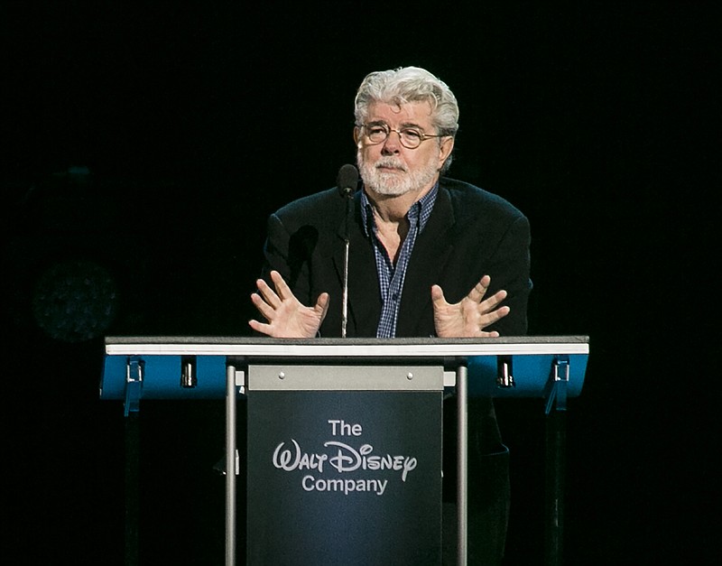 
              CORRECTS YEAR TO 2015, NOT 2014 - "Star Wars" creator, filmmaker George Lucas is honored with the Disney Legends Award, Friday, Aug. 14, 2015, in Anaheim, Calif. Lucas sold his company, and his iconic "Star Wars" film franchise, to Disney for $4 billion. (AP Photo/Damian Dovarganes)
            