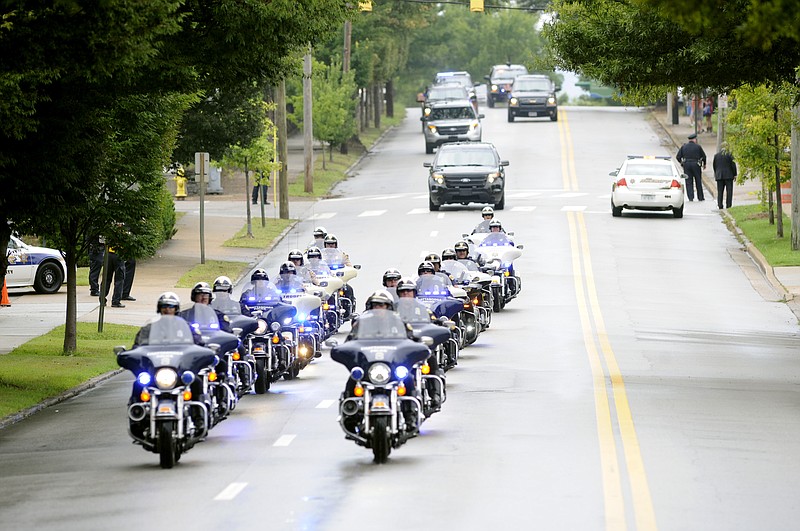 
              Vice President Joe Biden motorcade arrives at McKenzie Arena in Chattanooga, Tennessee memorial service Saturday, Aug. 15, 2015, in Chattanooga, Tenn. The service is for four Marines and a sailor killed as a result of attacks on a military recruiting station and a Naval operations center July 16 in Chattanooga. (AP Photo/Mark Gilliland)
            