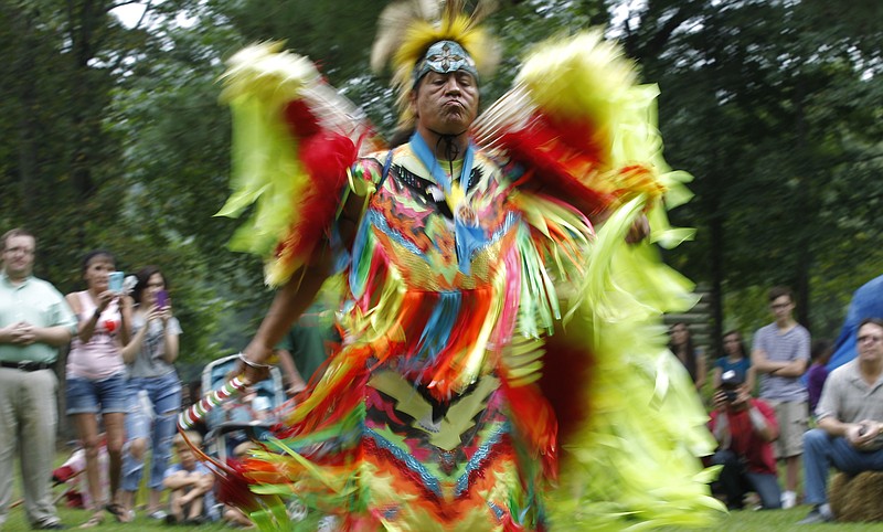 Jamie Pheasant performs a modern variation of a traditional pow-wow dance for a crowd at the Cherokee Heritage Festival at Red Clay State Park in Cleveland, Tenn., in this Aug. 2, 2014, file photo.