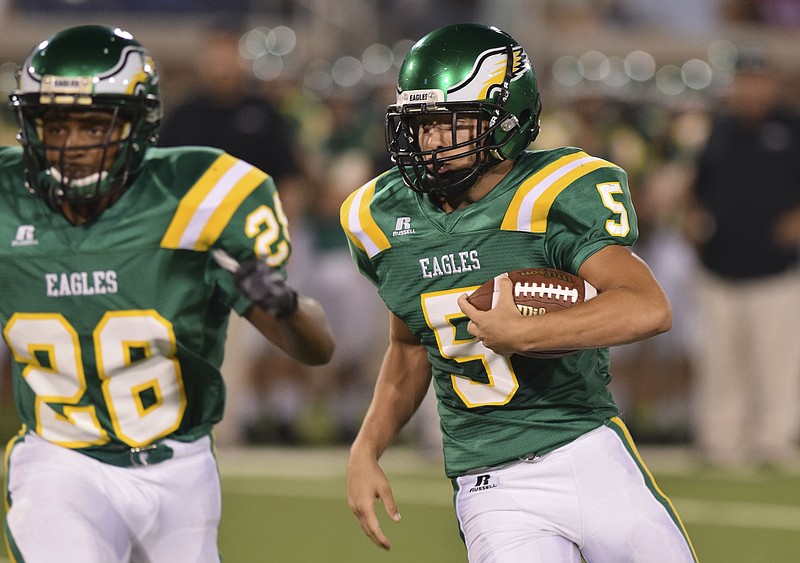 Braydon Davis (5) carries the ball for Rhea County behind Cameron Kerley (26) at the Chick-fil-A jamboree on Saturday at Finley Stadium. Rhea is ranked No. 2 in Class 5A in the state preseason poll.