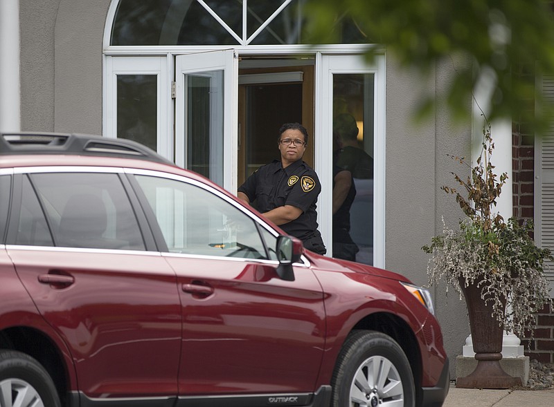 A security guard stands outside Dr. Walter Palmer's office in Bloomington, Minn., as it reopens on Aug. 17, 2015. (Renee Jones Schneider/Star Tribune via AP)  MANDATORY CREDIT