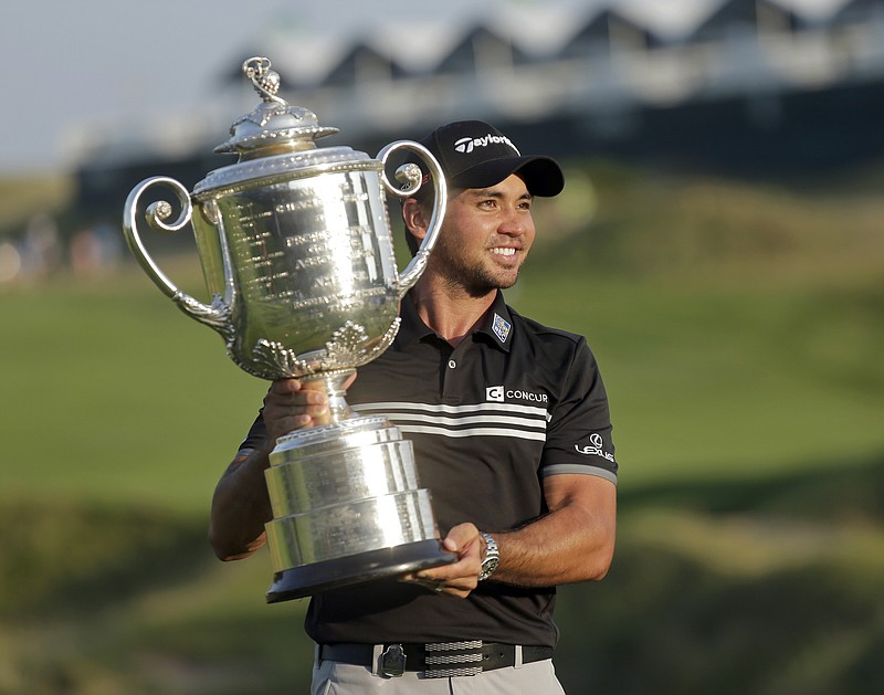 
              Jason Day, of Australia, holds up the Wanamaker Trophy after winning the PGA Championship golf tournament Sunday, Aug. 16, 2015, at Whistling Straits in Haven, Wis. (AP Photo/Chris Carlson)
            