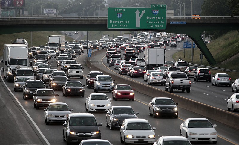 In this June 26, 2015 file photo, heavy traffic moves away from and toward the downtown area of Nashville, Tenn. (AP Photo/Mark Humphrey, File)