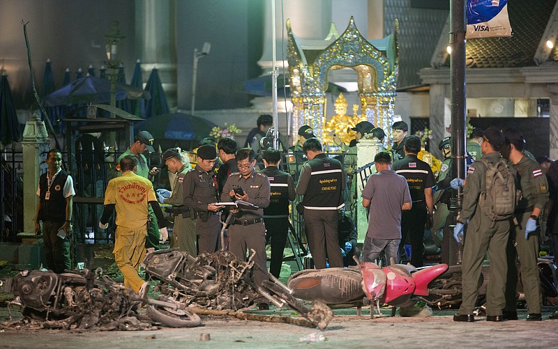 Police investigate the scene at the Erawan Shrine after an explosion in Bangkok,Thailand, Monday, Aug. 17, 2015.