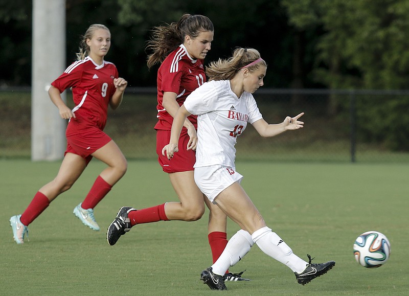 Baylor's Chloe Maize, right, shoots ahead of Signal Mountain's Ashley G. Buttram, left, and Avery Engels during their soccer match at Baylor School on Tuesday, Aug. 18, 2015, in Chattanooga.