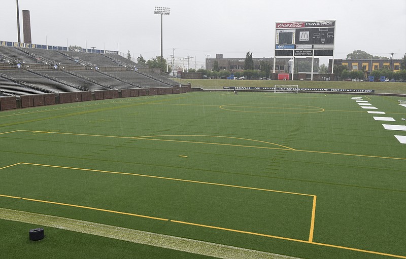 Gordon Davenport Field at Finley Stadium, seen during a steady rain on Monday, Aug. 17, 2015, in Chattanooga, Tenn., uses an Astroturf surface. This playing service is the second AstroTurf field to be installed at Finley. 