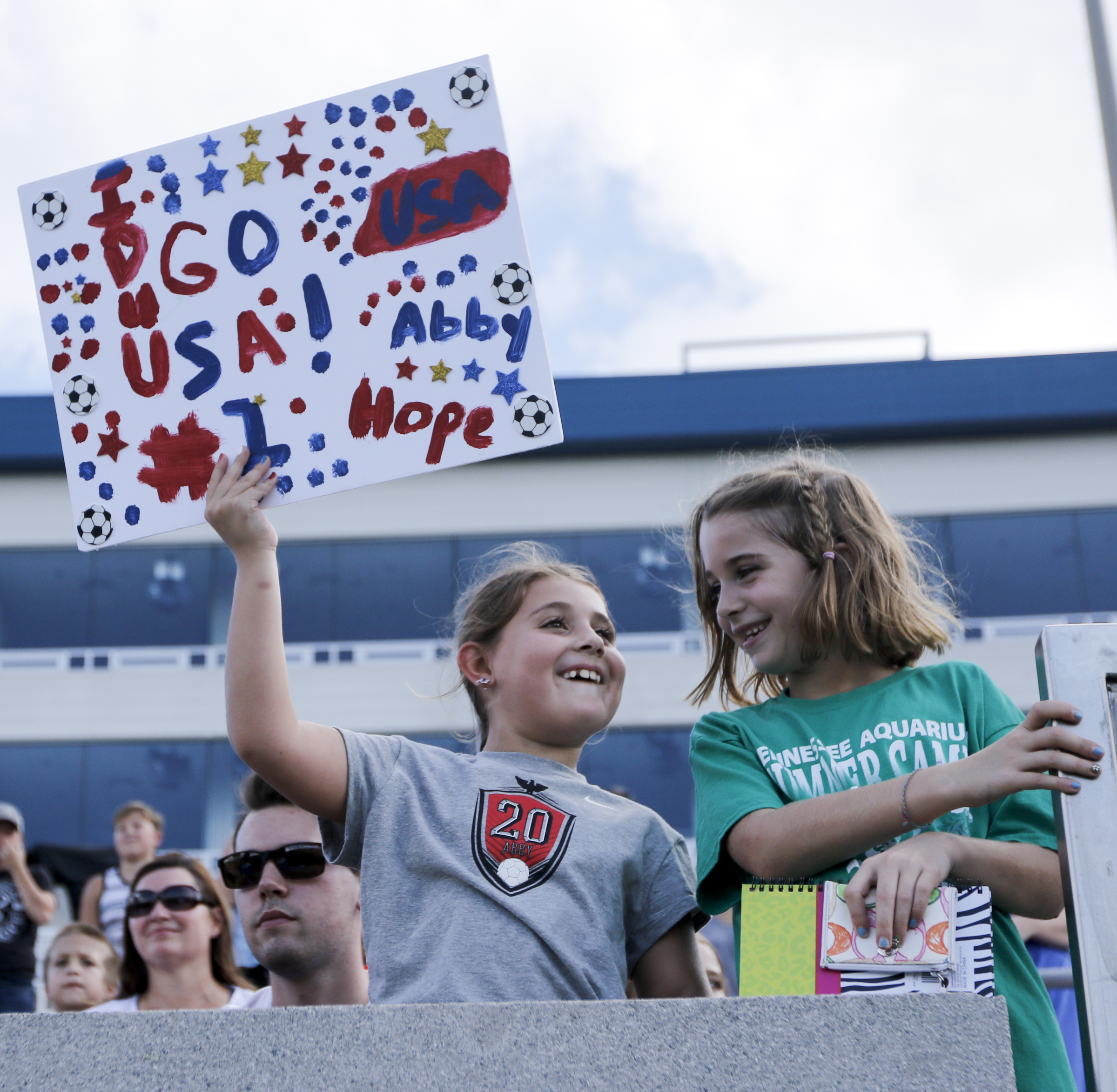 Lilly Adair, left, and Autumn Woodard cheer for the U.S. Women's National Soccer Team as they practice at Finley Stadium on Tuesday, Aug. 18, 2015, in Chattanooga, Tenn. The team plays Costa Rica on Wednesday at Finley Stadium.