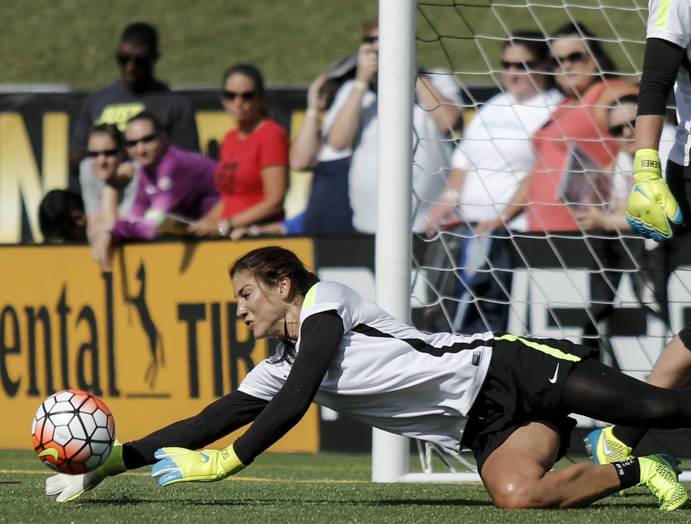 U.S. Women's National Soccer Team goalkeeper Hope Solo deflects the ball during practice at Finley Stadium on Tuesday, Aug. 18, 2015, in Chattanooga, Tenn. The team plays Costa Rica on Wednesday at Finley Stadium.