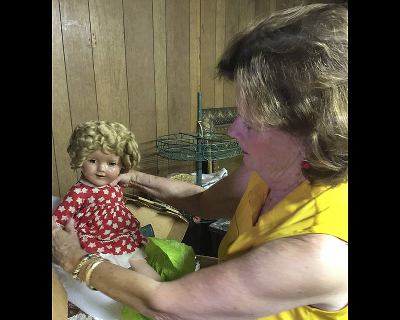 Karlyn Reedy finds a Shirley Temple doll in her family's warehouse on McCallie Avenue.