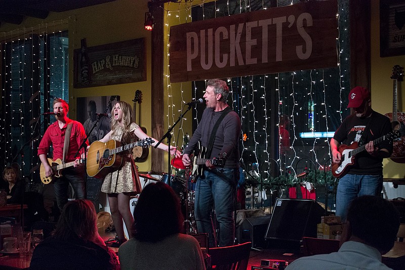 Musicians perform at Puckett's Gro. & Restaurant in Nashville. Puckett's will open next week in Chattanooga.Puckett's music Nashville