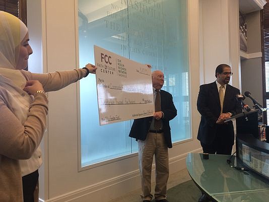 A check for $22,500 was donated to the families of Chattanooga shooting victims by the Faith and Culture Center of Nashville on Monday afternoon at the Nashville Public Library.