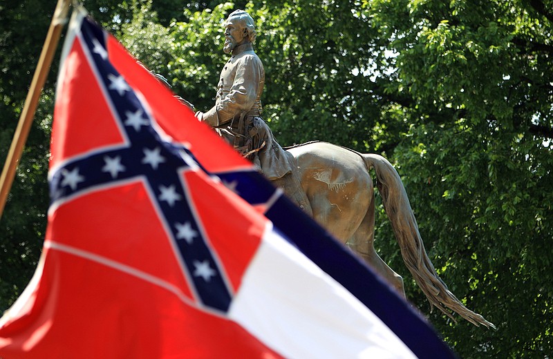 A flag waves in front of the statue and grave of civil war general Nathan Bedford Forrest at Health Sciences Park. 