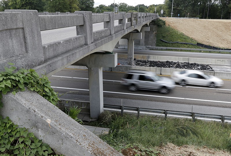 Vehicles pass on Highway 153 beneath the Shepherd Road overpass Wednesday in Chattanooga. The overpass will be rebuilt to help accommodate new traffic to the new Shepherd Road Coca-Cola facility.