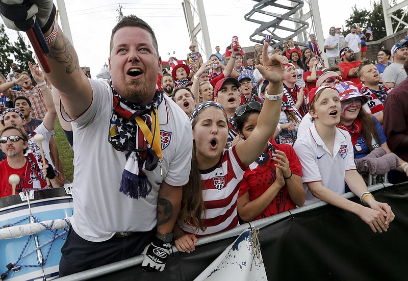 Fans cheer for U.S. women's national soccer team goalkeeper Hope Solo as she warms up before the team's match against Costa Rica at Finley Stadium on Wednesday.