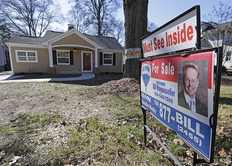 FILE - This Jan. 8, 2015 file photo shows a home for sale in Charlotte, N.C. National Association of Realtors releases existing home sales for July 2015 on Thursday, Aug. 20, 2015. (AP Photo/Chuck Burton, File)