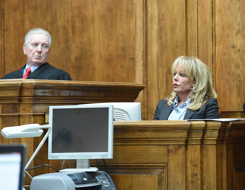 Angela Russell testifies in this May file photo as Judge Grant Brantley looks on.