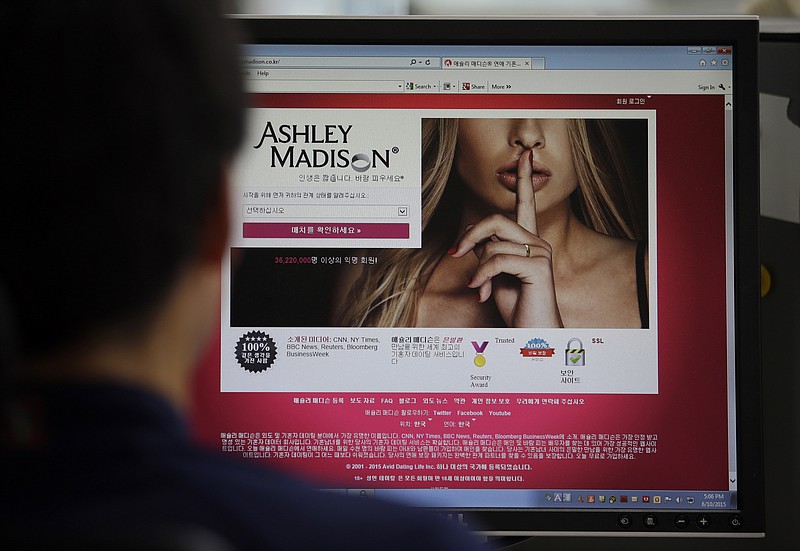 A June 10, 2015, photo from files showing Ashley Madison's Korean web site on a computer screen in Seoul, South Korea. Hackers claim to have leaked a massive database of users from Ashley Madison, a matchmaking website for cheating spouses. In a statement released Tuesday, a group calling itself Impact Team said the site's owners had not bowed to their demands. "Now everyone gets to see their data," the statement said.