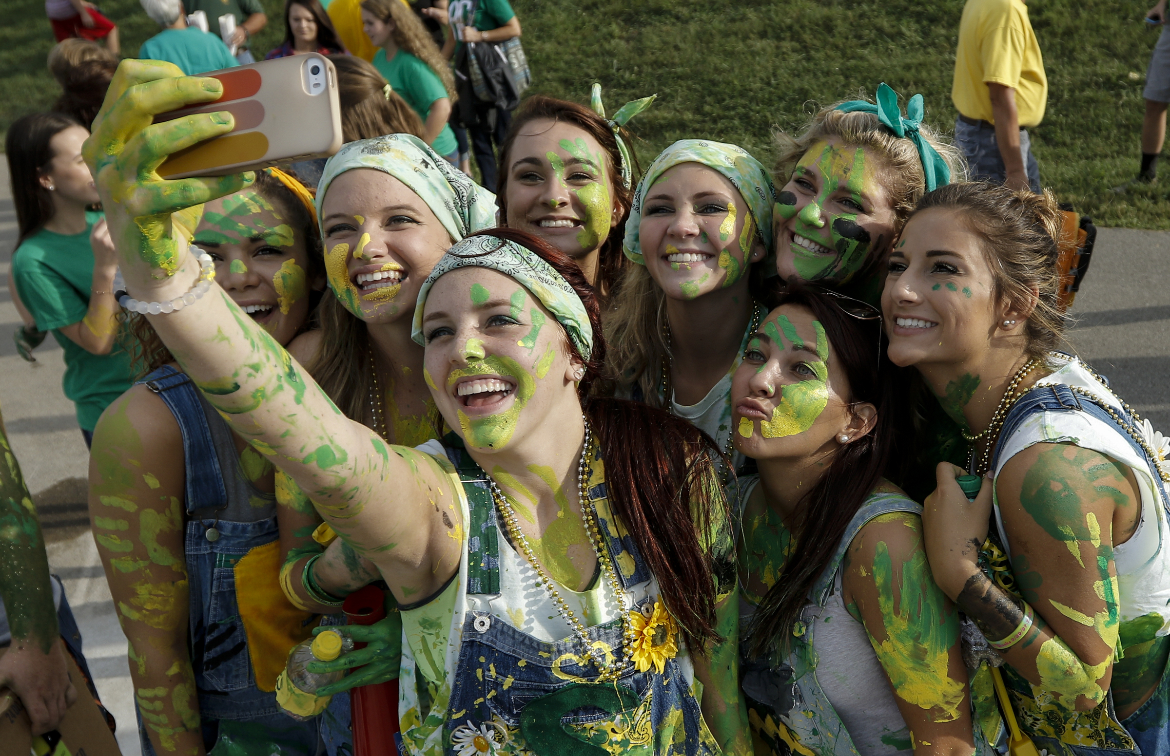 Rhea County fans take a selfie together before Rhea County's prep football game against Baylor at Rhea County High School on Thursday, Aug. 20, 2015, in Evensville, Tenn.
