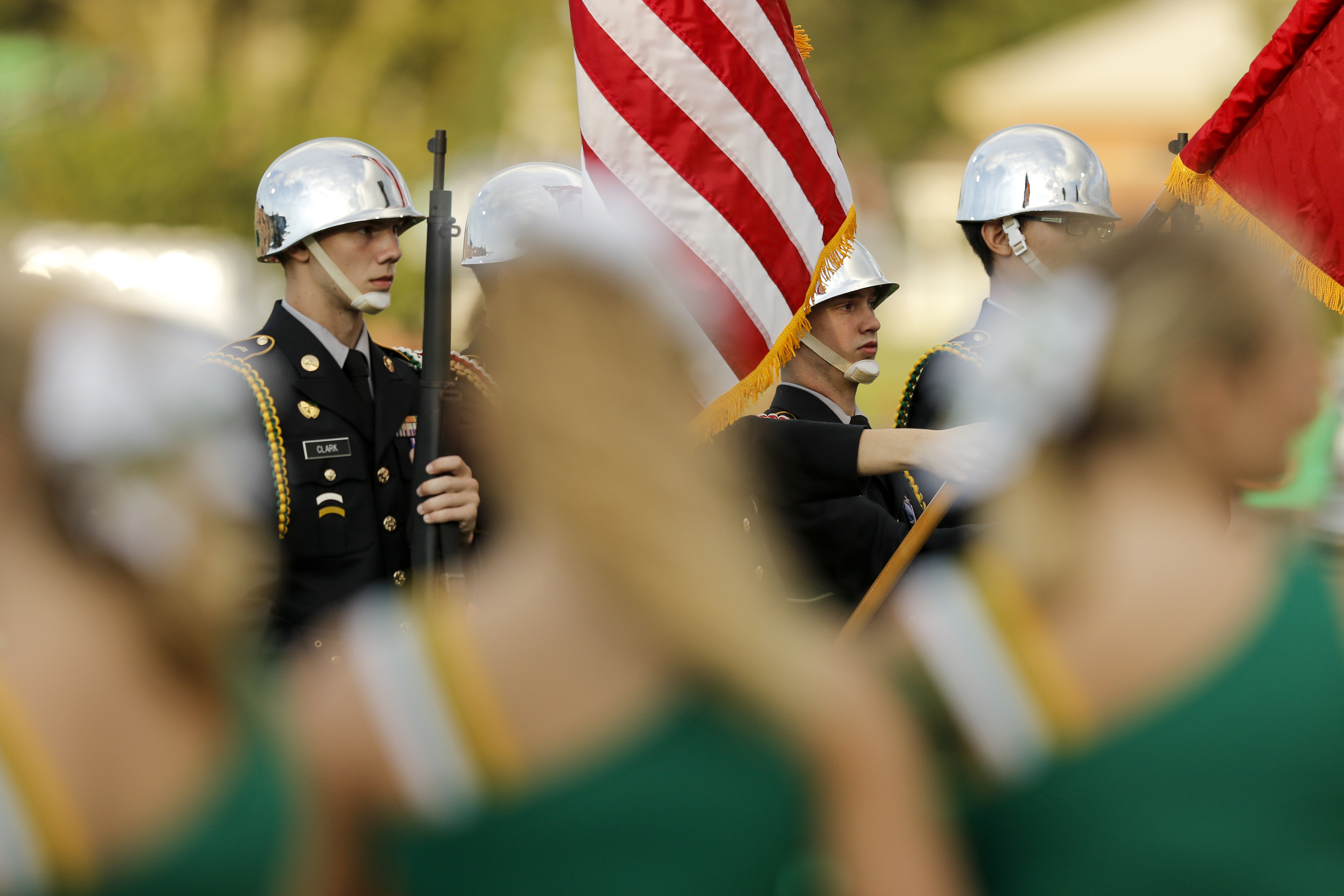 The Rhea County JROTC present the colors before their prep football game against Baylor at Rhea County High School on Thursday, Aug. 20, 2015, in Evensville, Tenn.