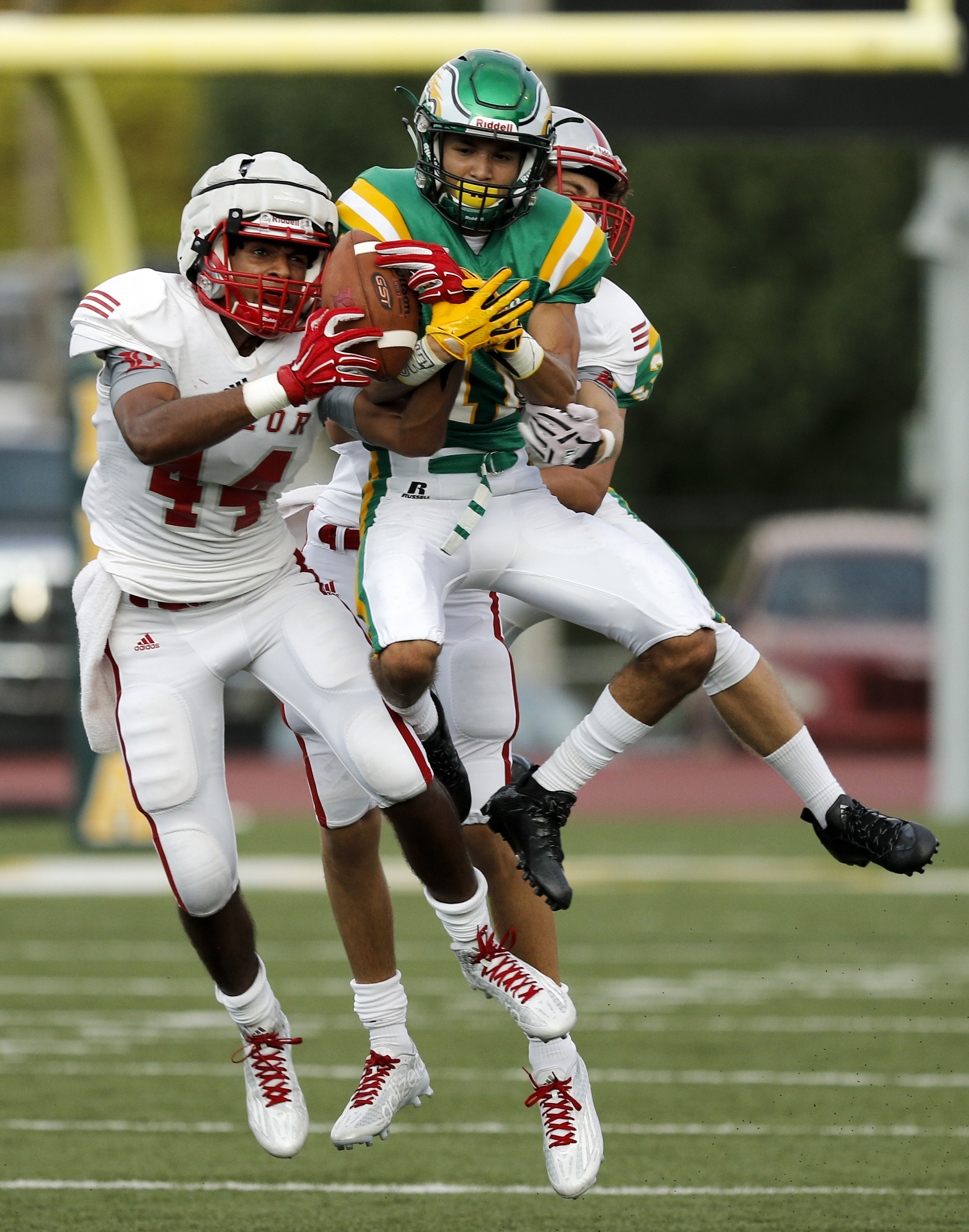 Baylor receiver Daniel Monroe, left, catches a pass against defender Noel Patterson during their prep football game at Rhea County High School on Thursday, Aug. 20, 2015, in Evensville, Tenn.