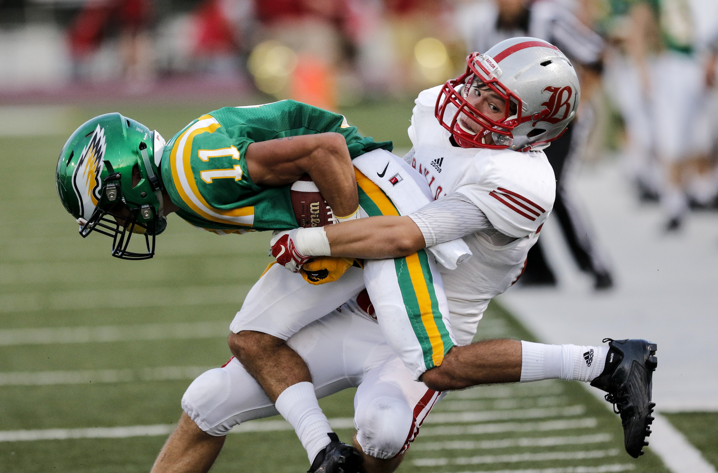 Baylor's George Pettway tackles Rhea County's Noel Patterson during Thursday night's season opener for both teams in Evensville, Tenn.