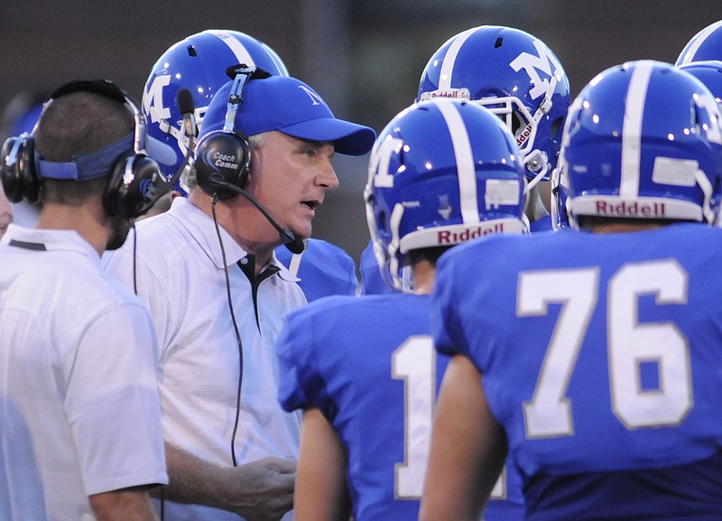 McCallie coach Ralph Potter talks to his offense just before halftime with Cleveland Thursday at Finley Stadium.