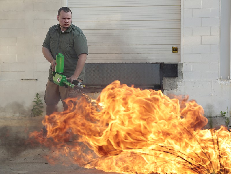 Ion Productions Team CEO Chris Byars demonstrates the XM42 he dubs the worlds' first commercially available handheld flamethrower on Tuesday Aug. 18, 2015, in Lake Orion, Mich. 