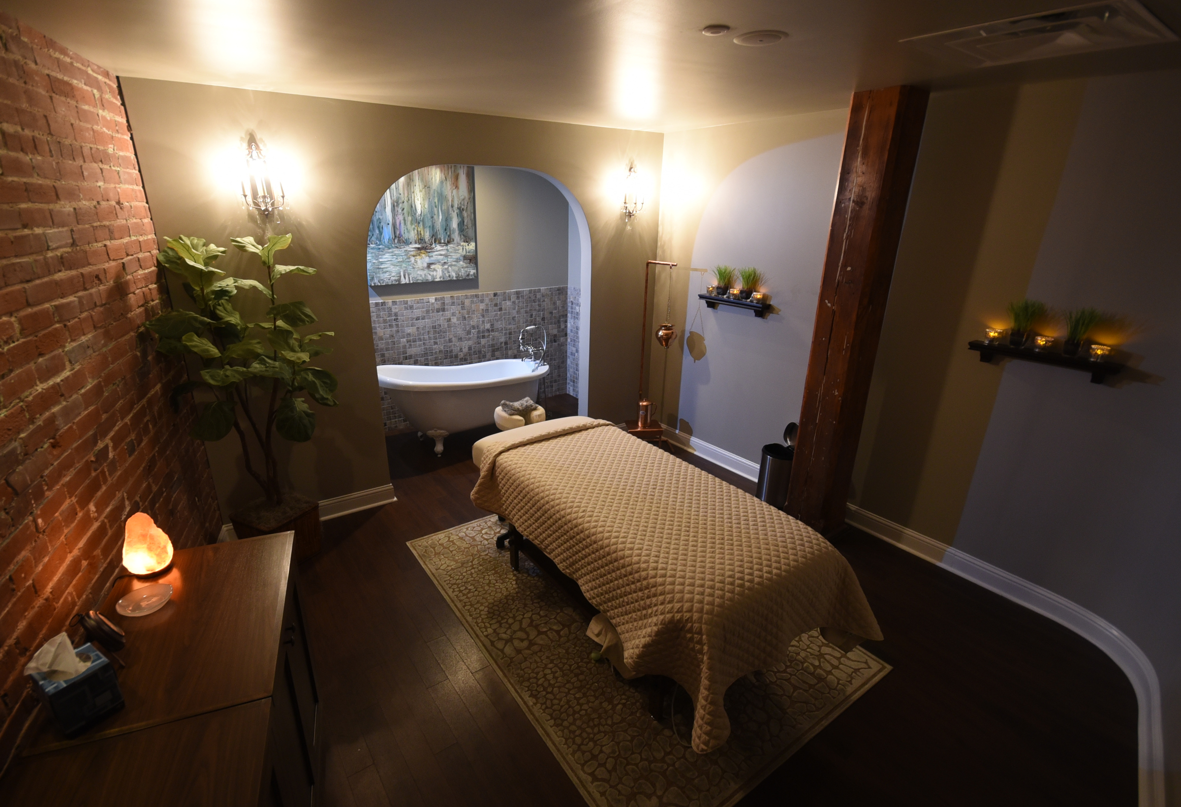 The "tub room" features an old-fashioned clawfoot tub where the client relaxes in a hot bath for 20 minutes before the massage begins.