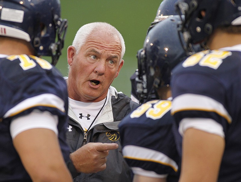 Walker Valley head football coach Glen Ryan talks to players on the sidelines during their prep football jamboree scrimmage game Saturday, Aug. 17, 2013, at Finley Stadium in Chattanooga, Tenn.