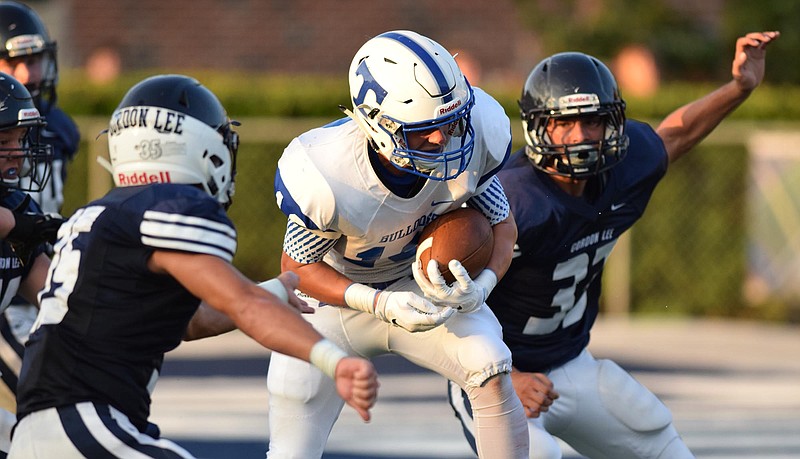 Trion's Gabe Howell (10) makes a large gain down inside the Gordon Lee twenty. The Trion Bulldogs visited the Gordon Lee Trojans in Georgia High School football action at Billy Neil Ellis Stadium in Chickamauga, Ga. Friday Night, August 21, 2015.