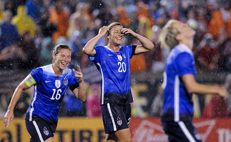 USA's Abby Wambach (20) and Lori Chalupny (16) react to a missed shot after sliding on the wet field during the U.S. Women's National Soccer Team's match against Costa Rica at Finley Stadium on Wednesday, Aug. 19, 2015, in Chattanooga, Tenn. The team is playing in Chattanooga as part of its Women's World Cup victory tour.