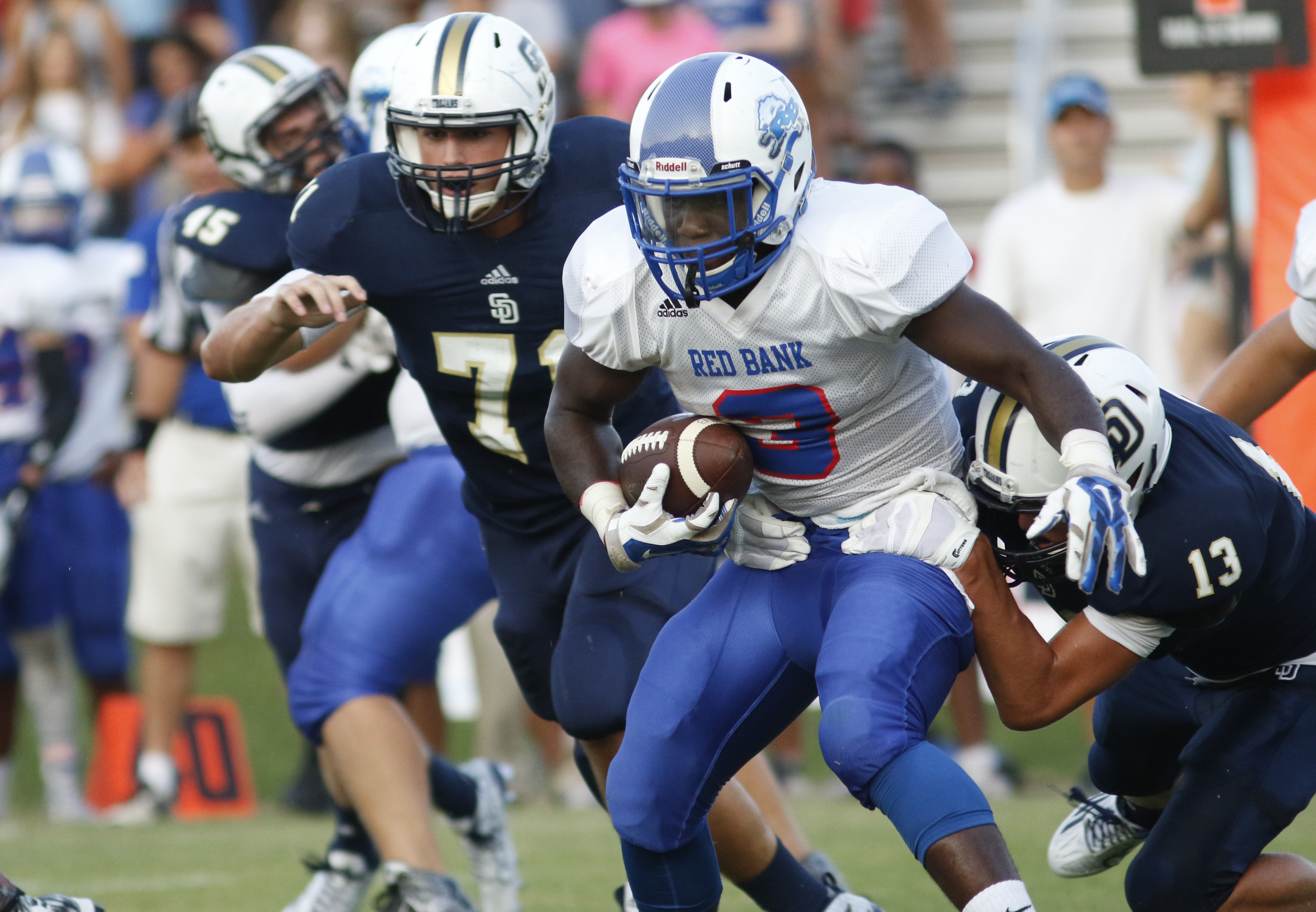 Red Bank High School's Destein Henderson (3) moves the ball while playing Soddy-Daisy during the first half of play at the Trojan's Robert Talaska field on August 21, 2015.