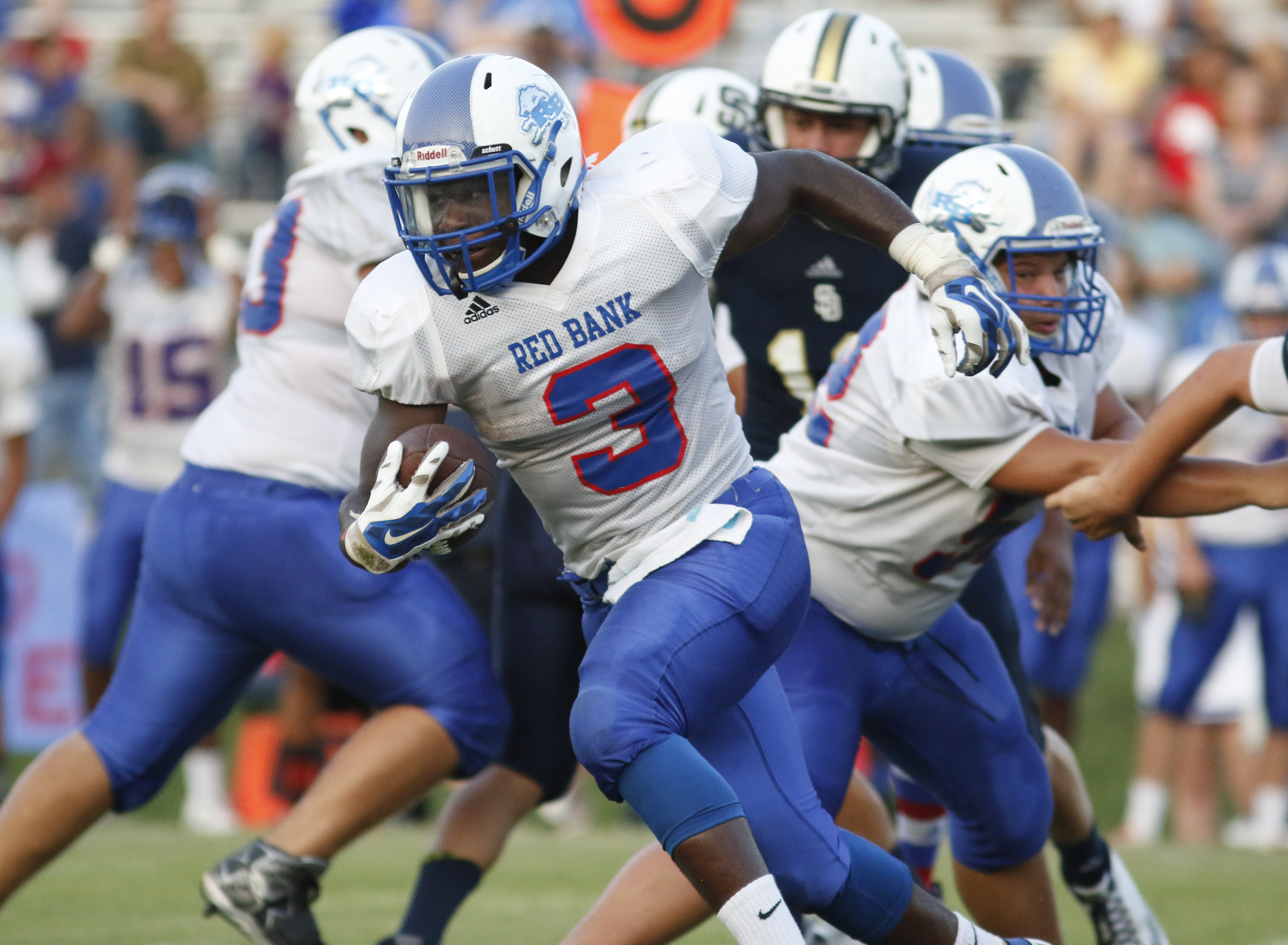 Red Bank High School's Destein Henderson (3) moves the ball against Soddy-Daisy during the first half of play at the Trojan's Robert Talaska field on August 21, 2015.