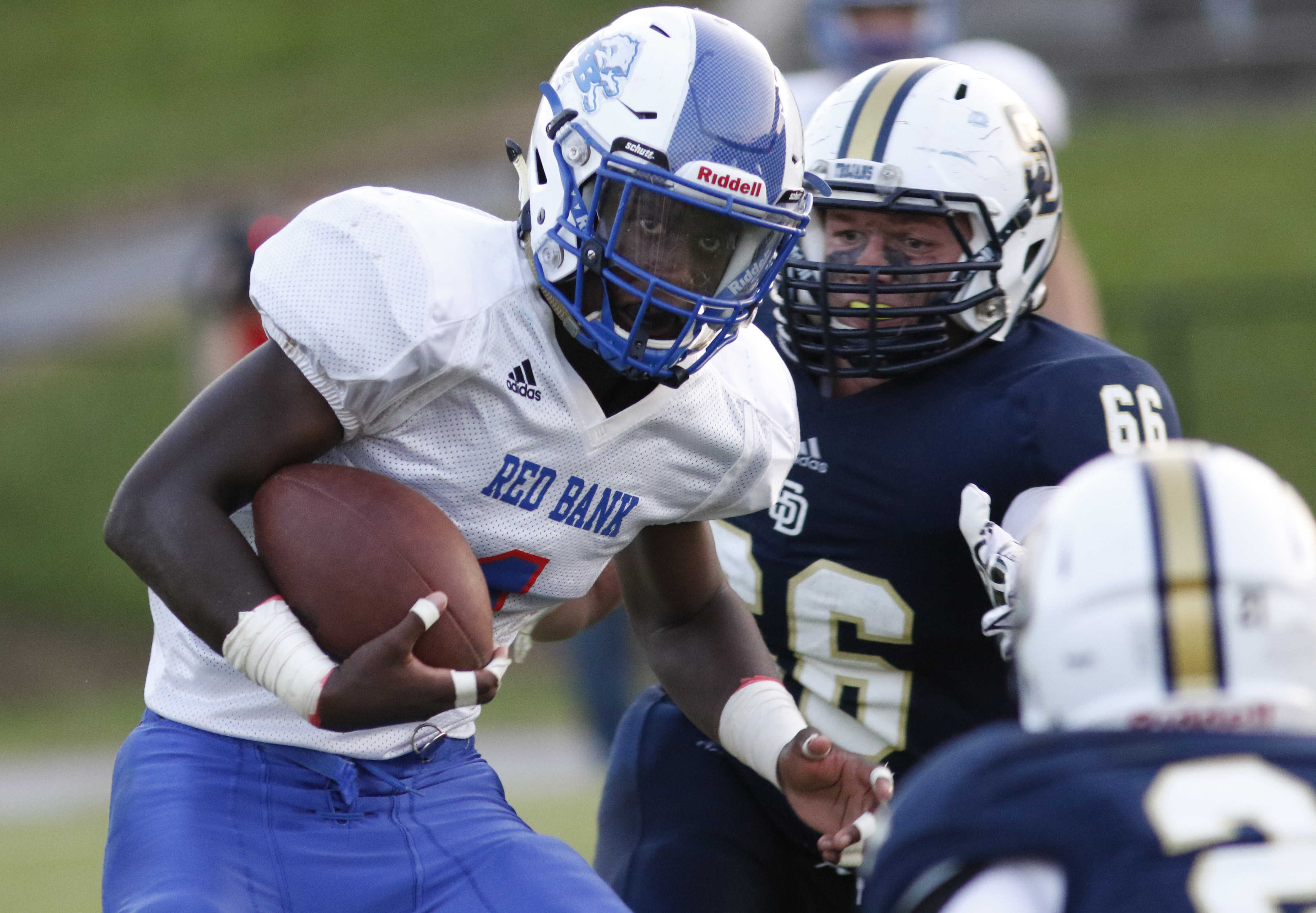 Red Bank high school's Demarcus Rivers (1) runs the ball against Soddy-Daisy during the first half of play at the Trojan's Robert Talaska field on August 21, 2015.