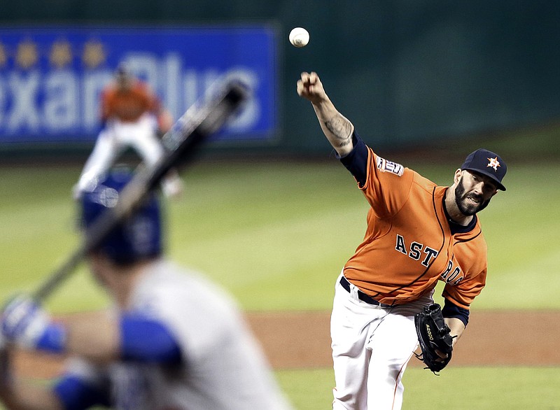 Houston Astros' Mike Fiers delivers a pitch to Los Angeles Dodgers' Chase Utley during the sixth inning of a baseball game Friday, Aug. 21, 2015, in Houston.