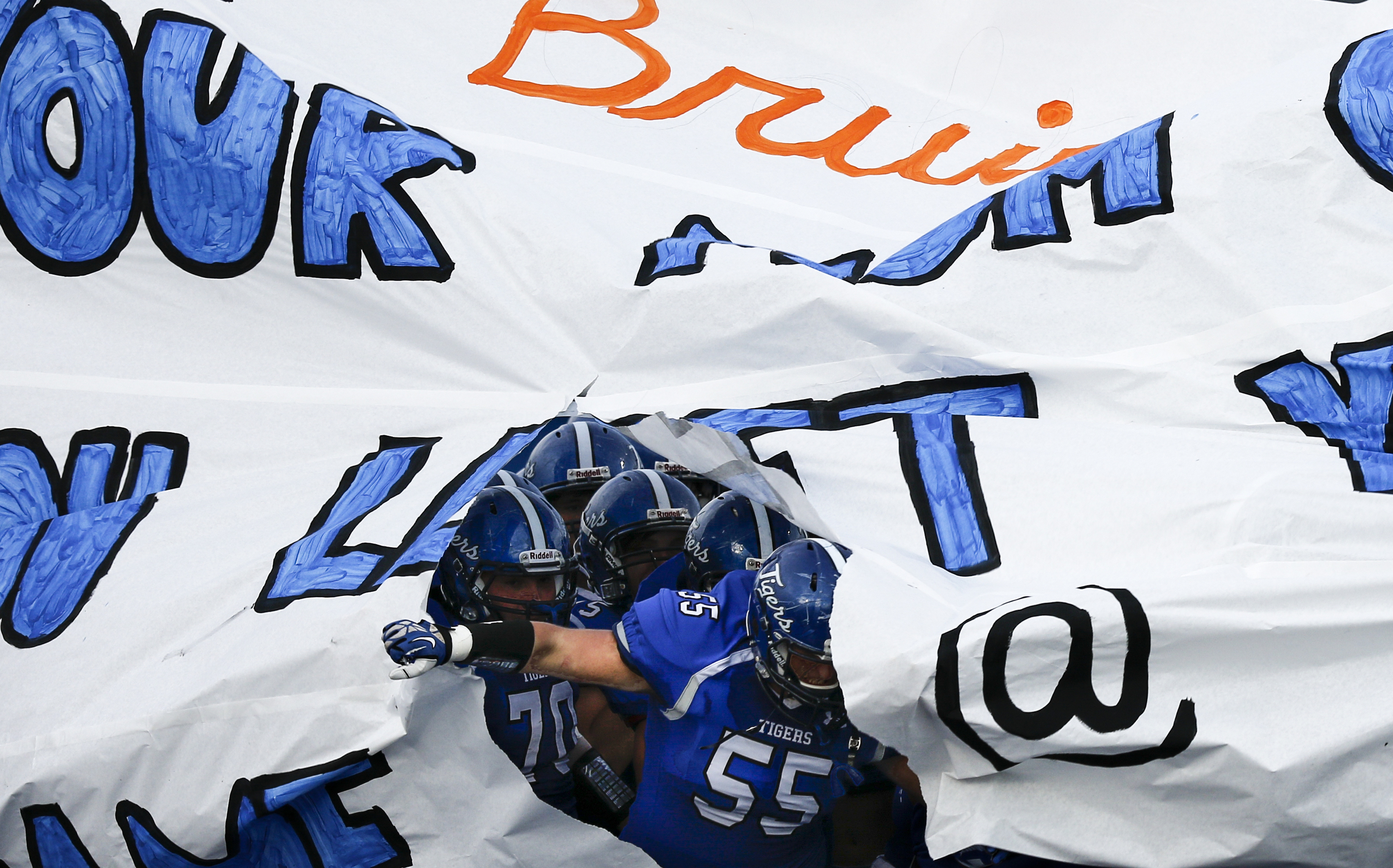 Ringgold rips open their banner to enter the field before their prep football game against Northwest Whitfield at Ringgold High School on Saturday, Aug. 22, 2015, in Ringgold, Ga.