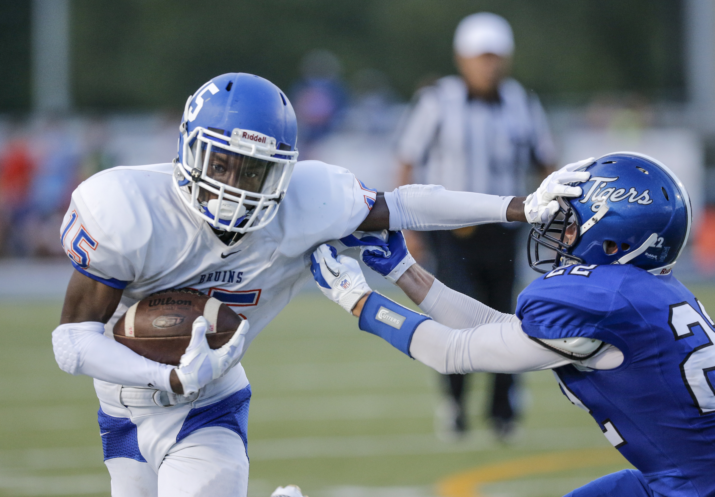 Northwest Whitfield's Jay Jones stiff-arms Ringgold defender Garrett Morris during their prep football game at Ringgold High School on Saturday, Aug. 22, 2015, in Ringgold, Ga.