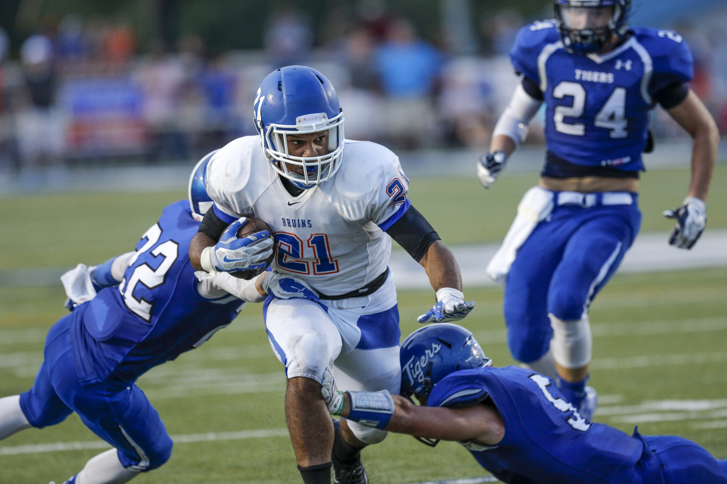 Northwest Whitfield's Devonte Dunn, center, carries between Ringgold defenders Garrett Morris, left, and Hunter Foskey during their prep football game at Ringgold High School on Saturday, Aug. 22, 2015, in Ringgold, Ga.