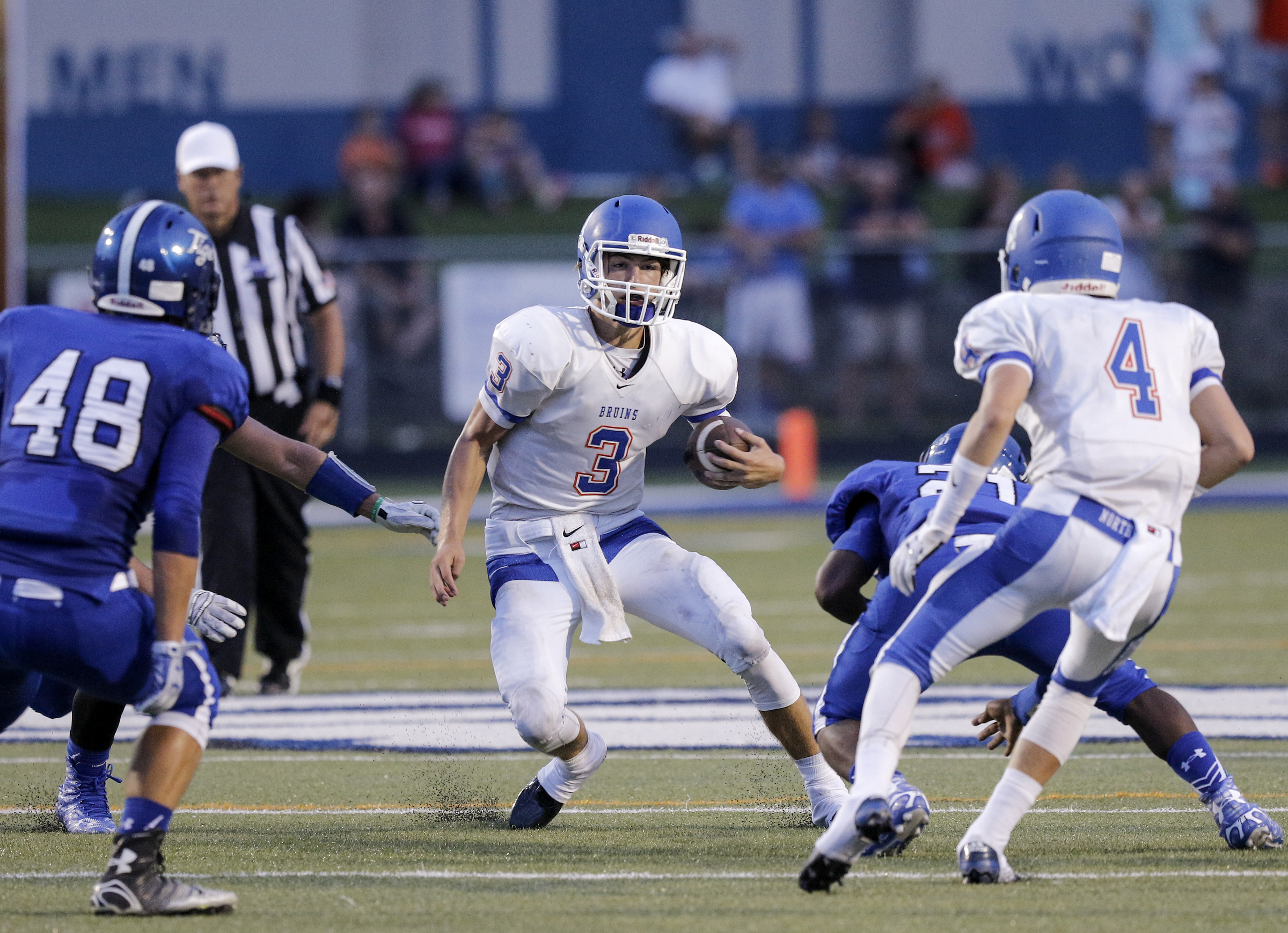 Northwest Whitfield's Luke Shiflett (3) carries up the middle towards Ringgold's Cameron Hood (48) during their prep football game at Ringgold High School on Saturday, Aug. 22, 2015, in Ringgold, Ga.