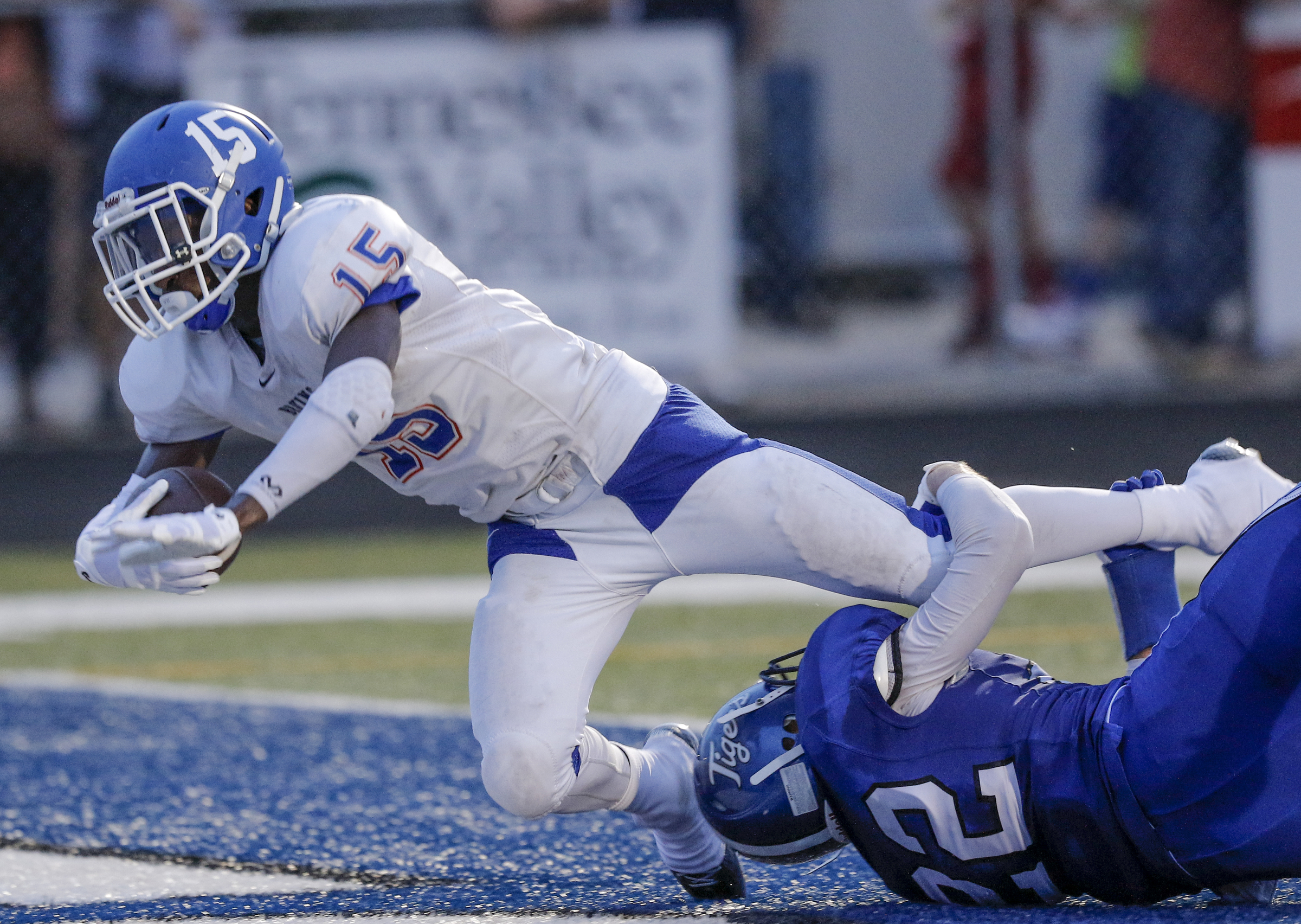 Northwest Whitfield's Jay Jones is tackled in the end zone by Ringgold defender Garrett Morris for a touchdown during their prep football game at Ringgold High School on Saturday, Aug. 22, 2015, in Ringgold, Ga.