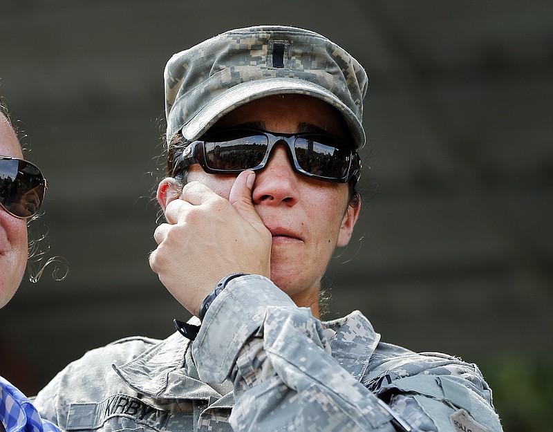 
              U.S. Army First Lt. Alessandra Kirby wipes away a tear after a Ranger School graduation ceremony, Friday, Aug. 21, 2015, at Fort Benning, Ga. First Lt. Shaye Haver and Capt. Kristen Griest became the first female soldiers to complete the course and receive their Ranger tabs. (AP Photo/John Bazemore)
            