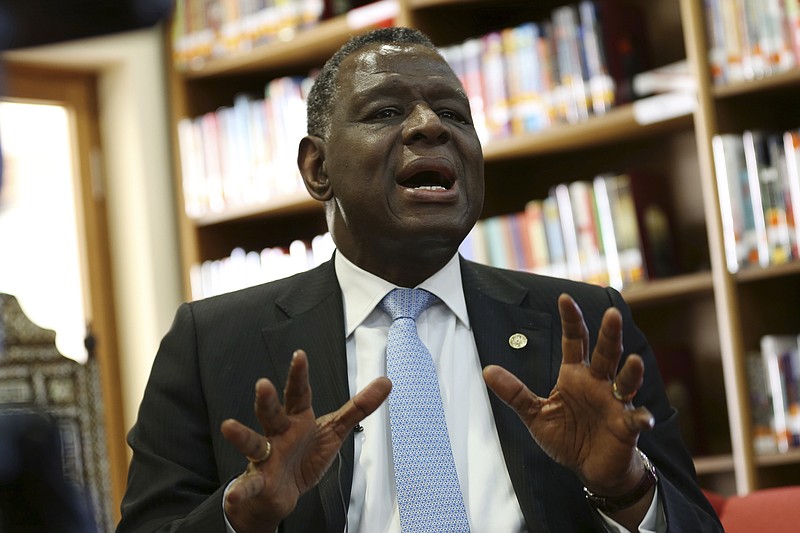 
              In this Friday, Aug. 21, 2015 photo, Executive Director of the United Nations Population Fund, Babatunde Osotimehin speaks during an interview with The Associated Press at the Global Forum for Youth, Peace and Security, in Madaba, Jordan. The “new mantra” of the U.N. Population Fund is to keep girls in school until age 18 “in every nook and cranny of the world” as the best way to slow population growth, the head of the agency said. (AP Photo/Raad Adayleh)
            