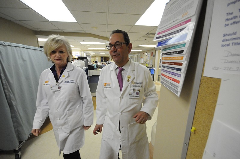 Chief Nursing Executive Jan Keys, left, leaves the Emergency Department with Erlanger CEO Kevin Spiegel, as the top executive accompanies her on her rounds in this 2014 file photo.