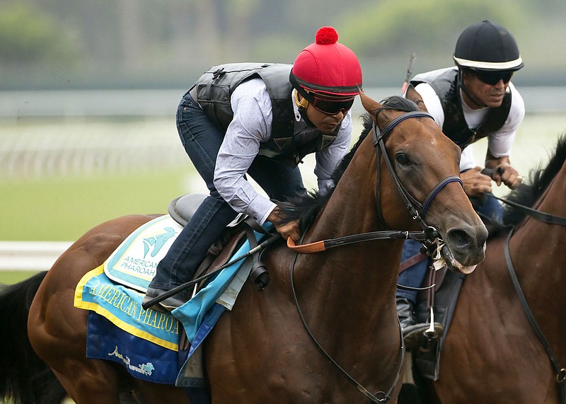 
              Triple Crown winner American Pharoah and jockey Martin Garcia appear during a workout, Sunday Aug. 23, 2015 at Del Mar Thoroughbred Club in Del Mar, Calif. American Pharoah will run next in the Travers Stakes at a sold-out Saratoga Race Course on Saturday. (Benoit Photo via AP)
            