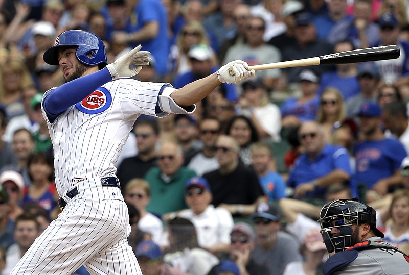 Chicago Cubs' Kris Bryant hits an one-run double during the sixth inning of a baseball game against the Atlanta Braves Friday, Aug. 21, 2015, in Chicago. 