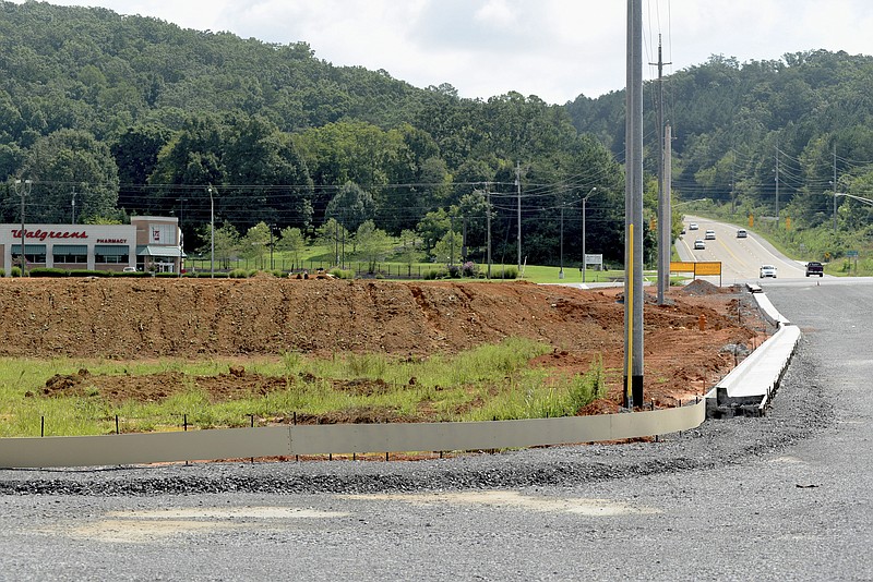 A stalled curbing and storm drain project is seen at a development at the intersection of Paul Huff Parkway and Georgetown Road on Monday, Aug. 24, 2015, in Cleveland, Tenn. Although not part of the official agenda, the Cleveland City Council was expected to vote Monday on officially acquiring right of way for the development that has already started, essentially developing private property with sidewalks, curbing and guttering. Work was recently halted