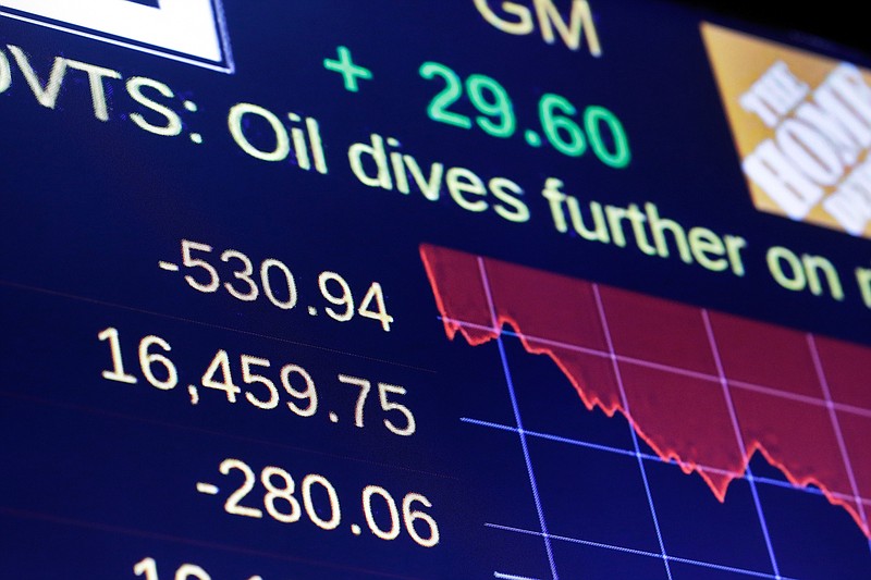 A screen above the trading floor of the New York Stock Exchange shows the closing numbers Friday, Aug. 21, 2015.