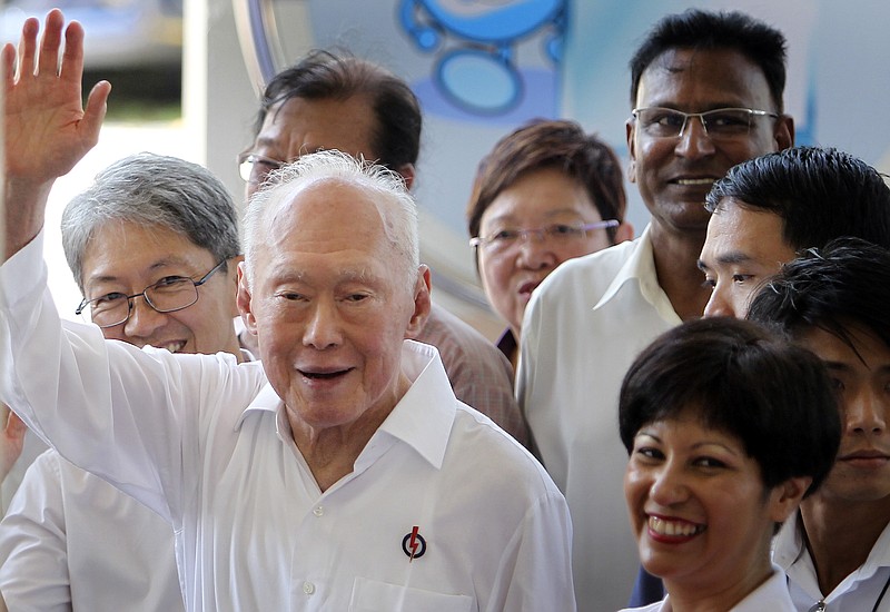 
              FILE - In this April 27, 2011 file photo, then Singapore's Minister Mentor Lee Kuan Yew waves to supporters as he arrives at an elections nomination center, in Singapore.  Singapore will hold a general election on Sept. 11, 2015,  the government announced Tuesday, Aug. 25, 2015,  in what is expected to be a tight contest for the ruling party that has dominated politics in the city-state for 50 years but is now facing growing disaffection among citizens. (AP Photo/Wong Maye-E, File)
            